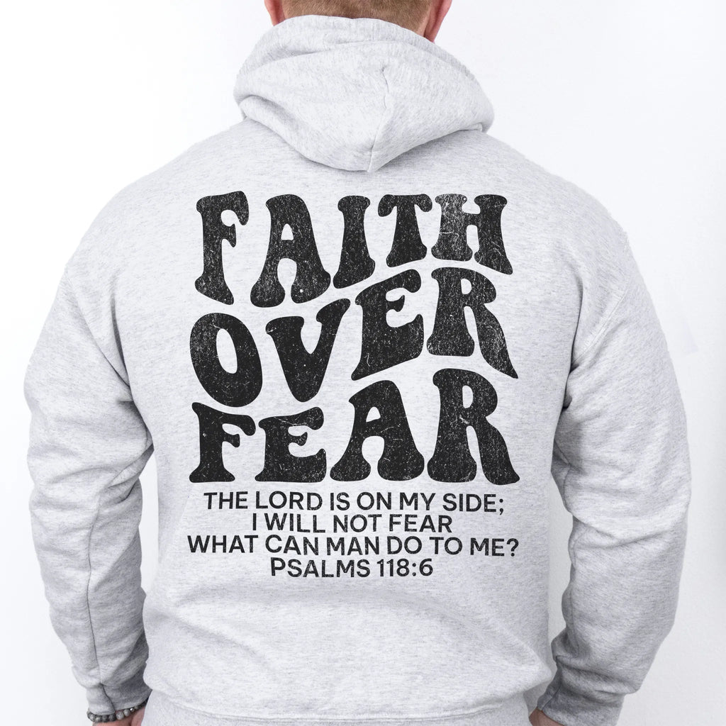 Ash Oakley June hoodie, mens fit, large back lettering reads Faith Over Fear with supporting scripture lines, studio back view