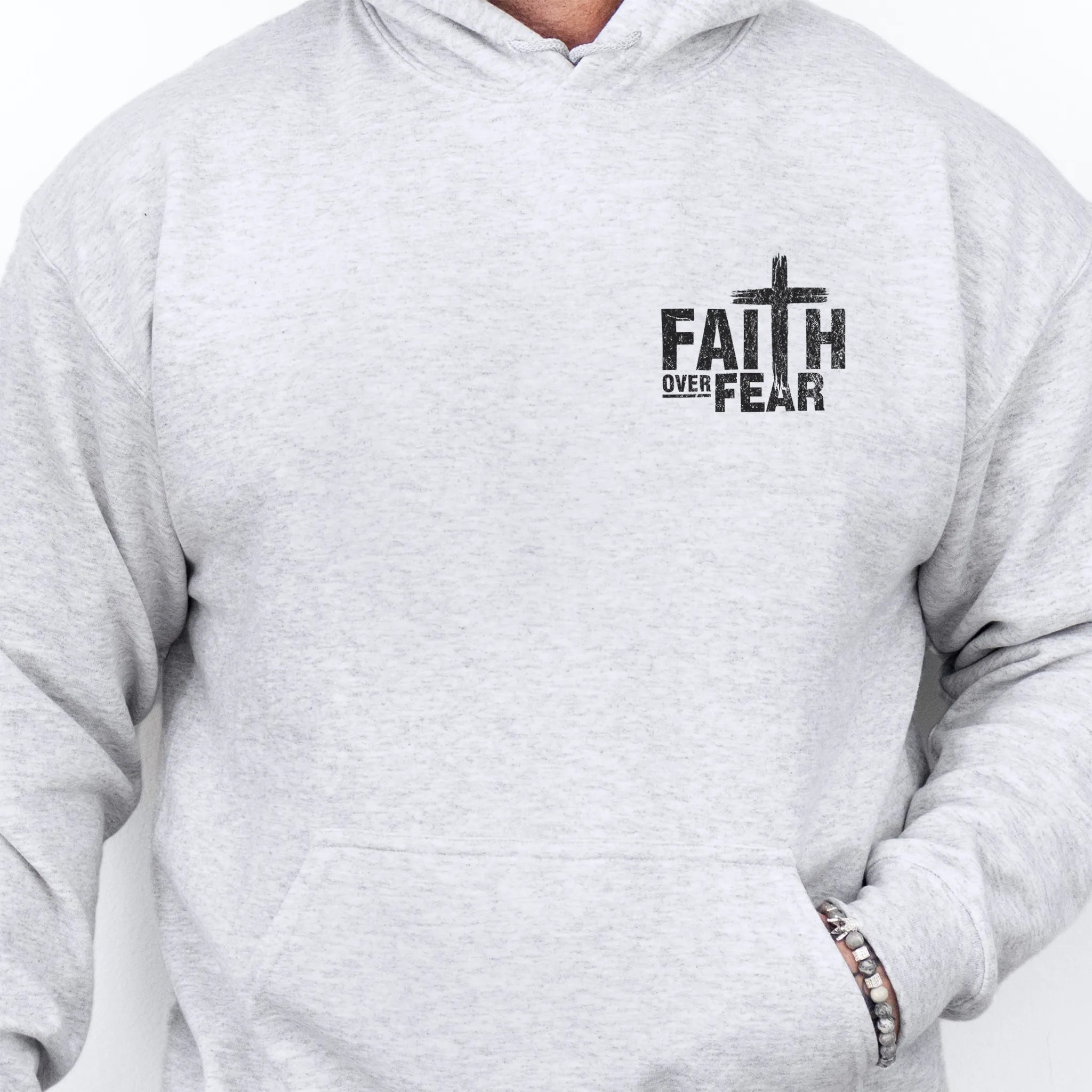 Ash Oakley June hoodie, mens fit, left chest badge reads Faith Over Fear with cross, kangaroo pocket, studio front view