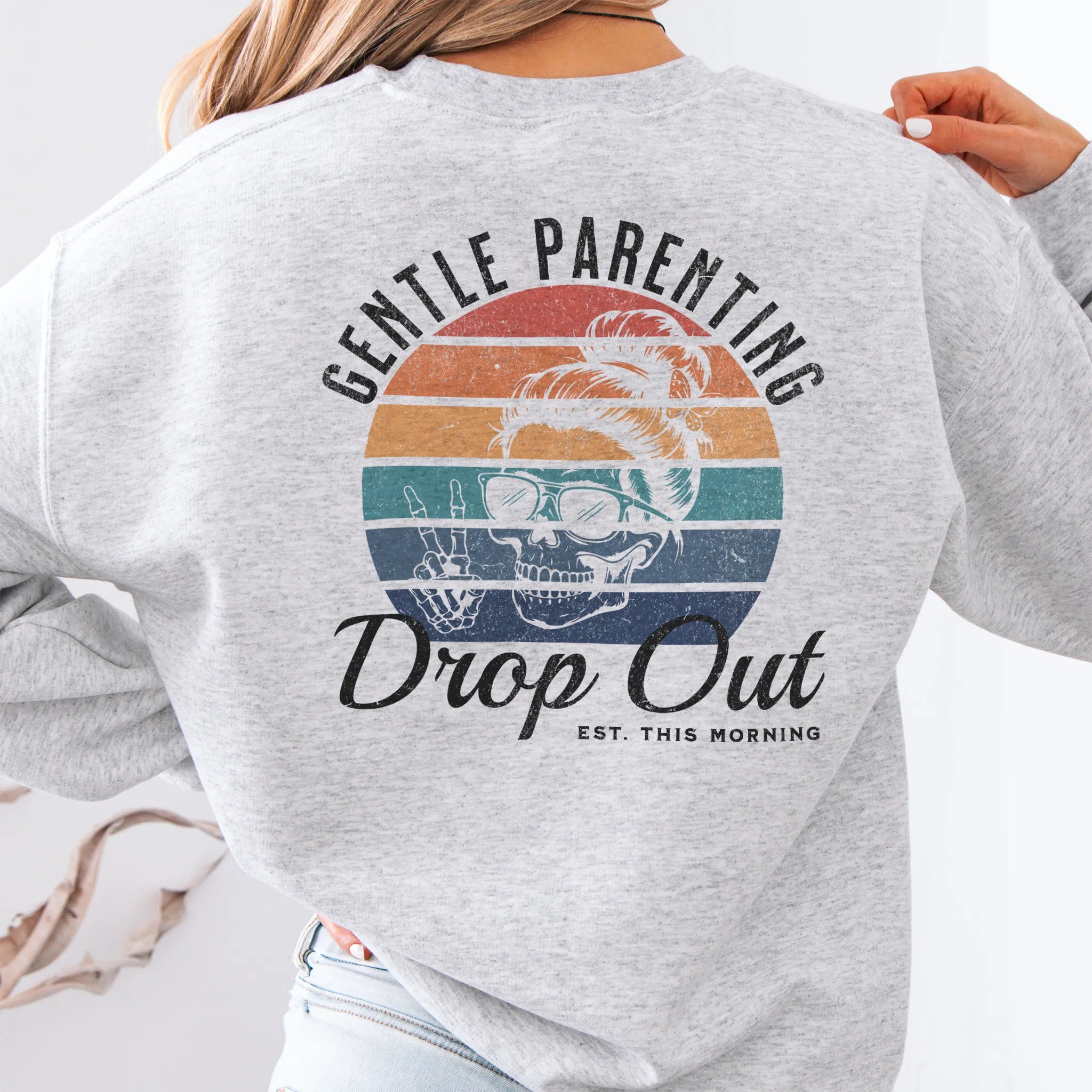 Ash Oakley June Sweatshirt back view Gentle Parenting Drop Out large round retro stripe badge skull with messy bun peace sign script Est This Morning distressed print