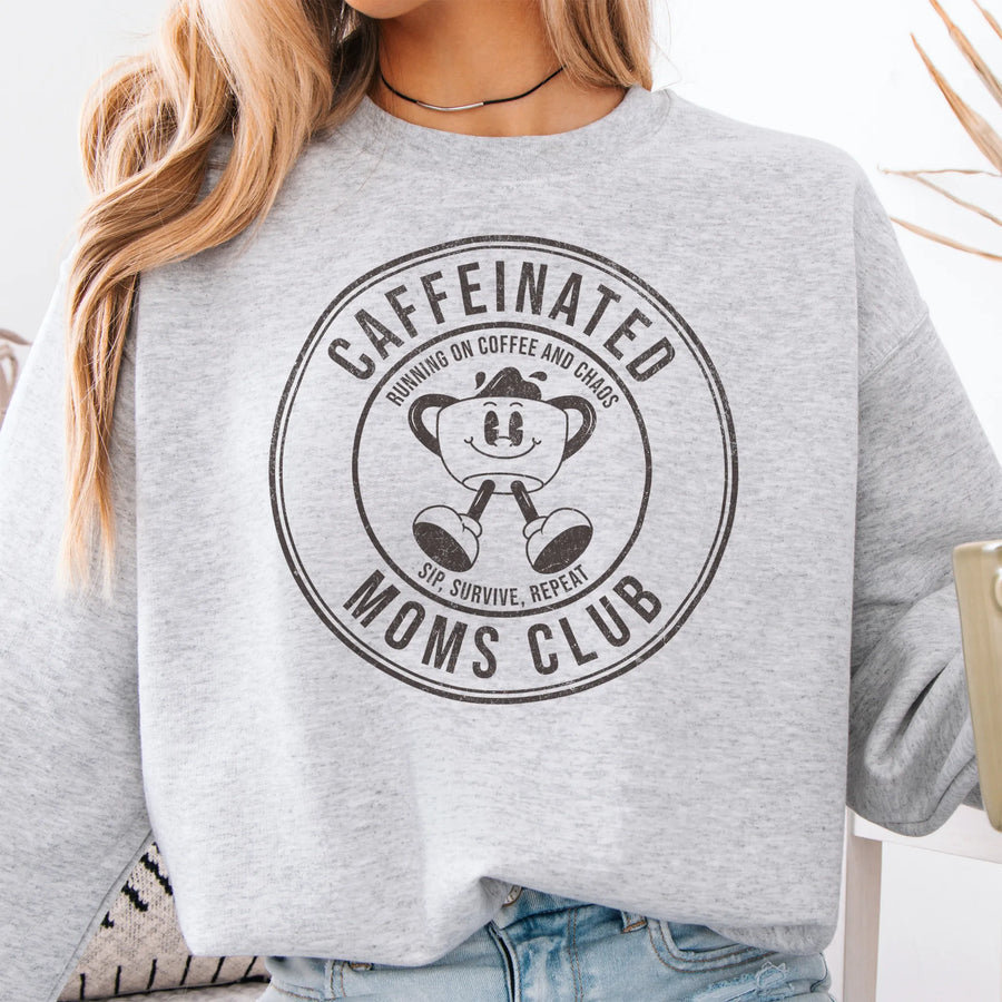 Ash Oakley June Sweatshirt front view large Caffeinated Moms Club circle badge coffee cup mascot text Running on Coffee and Chaos Sip Survive Repeat mono black ink distressed