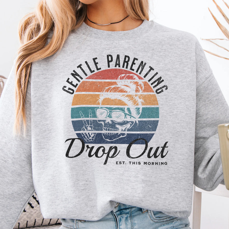 Ash Oakley June Sweatshirt front view Gentle Parenting Drop Out large chest graphic skull with messy bun peace sign round retro stripe badge text Est This Morning distressed print