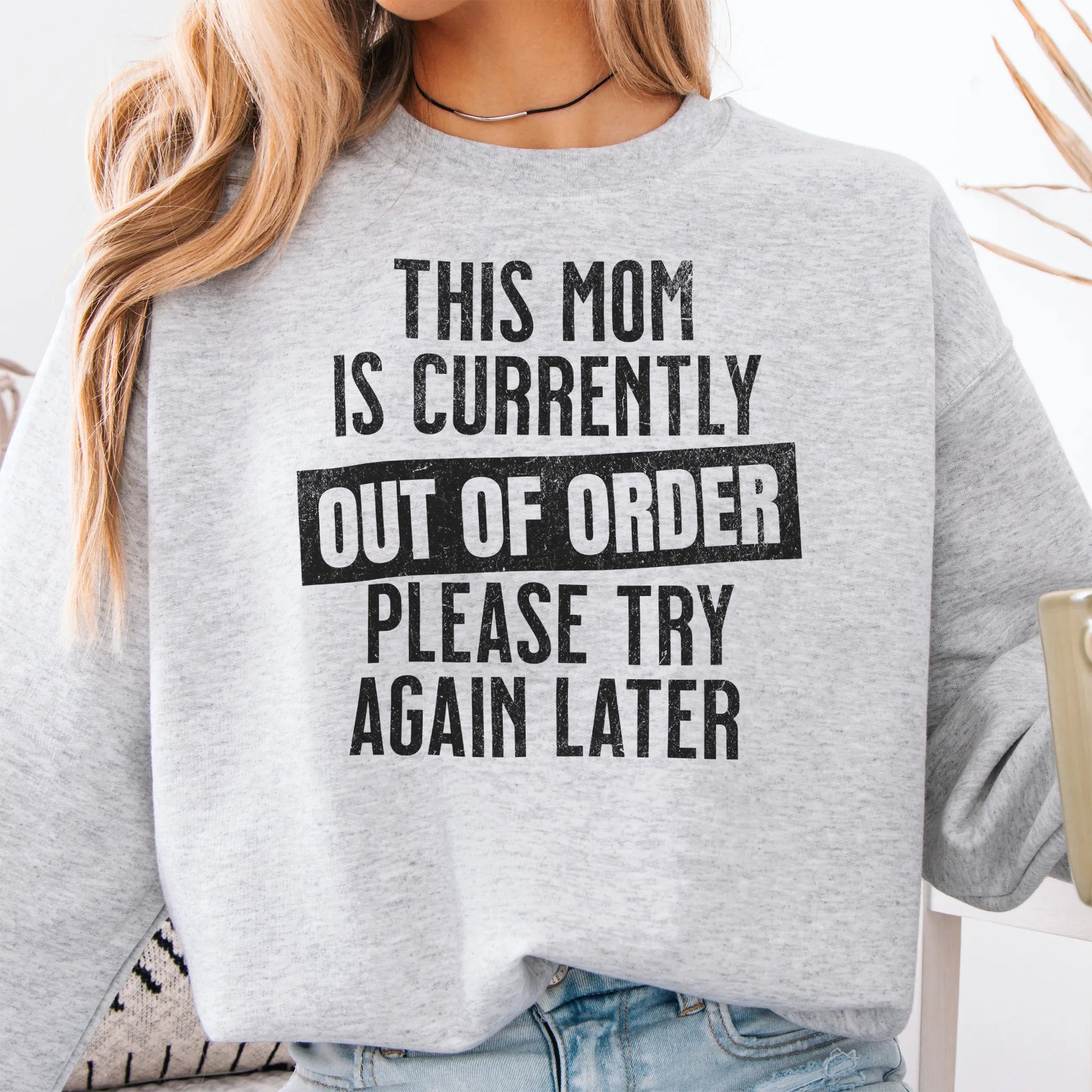 Ash sweatshirt – large front text reads “This Mom Is Currently Out of Order, Please Try Again Later”, relaxed modern fit, cropped to torso, studio front view