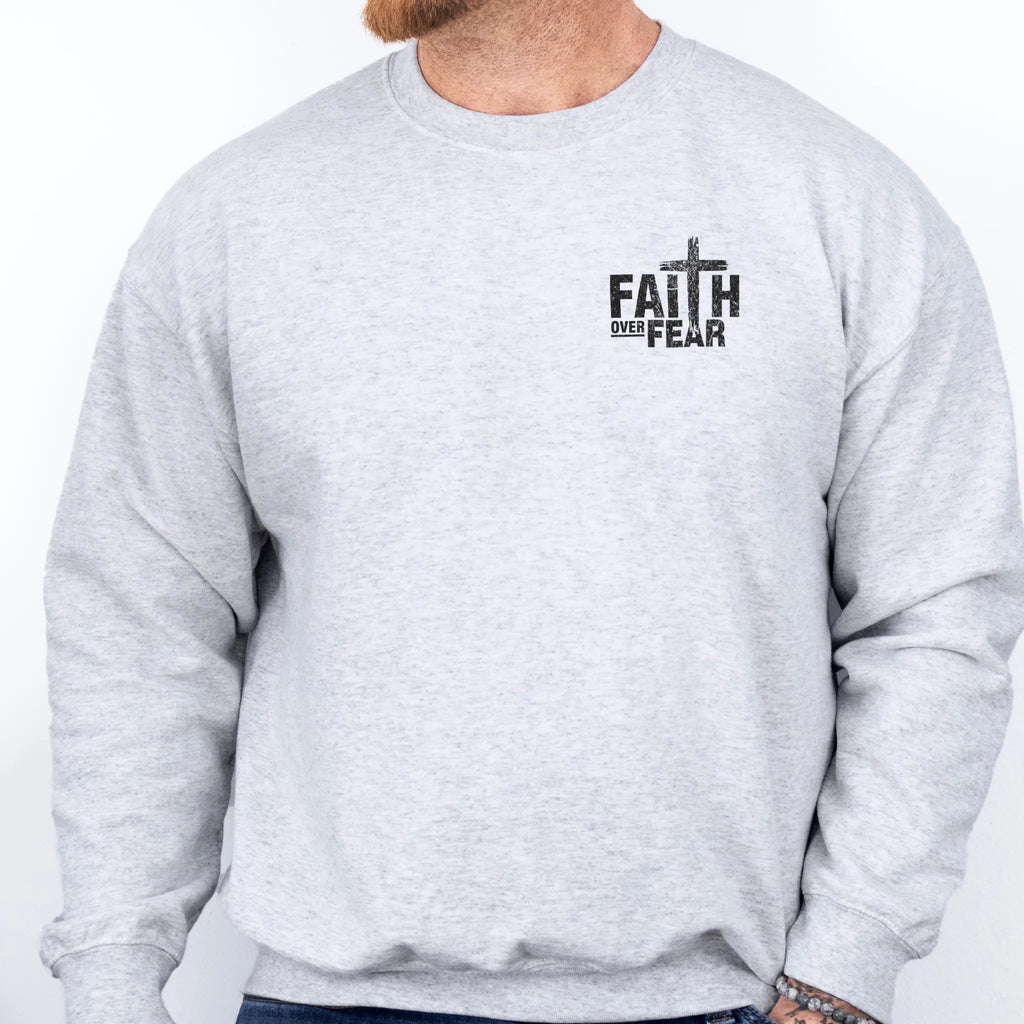 Ash Oakley June sweatshirt, mens fit, left chest badge reads Faith Over Fear with cross, studio front view