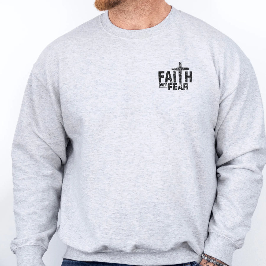 Ash Oakley June sweatshirt, mens fit, left chest badge reads Faith Over Fear with cross, studio front view
