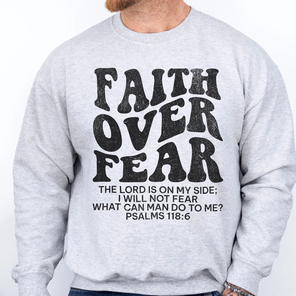 Ash Oakley June sweatshirt, mens fit, left chest badge reads Faith Over Fear with cross, studio front view