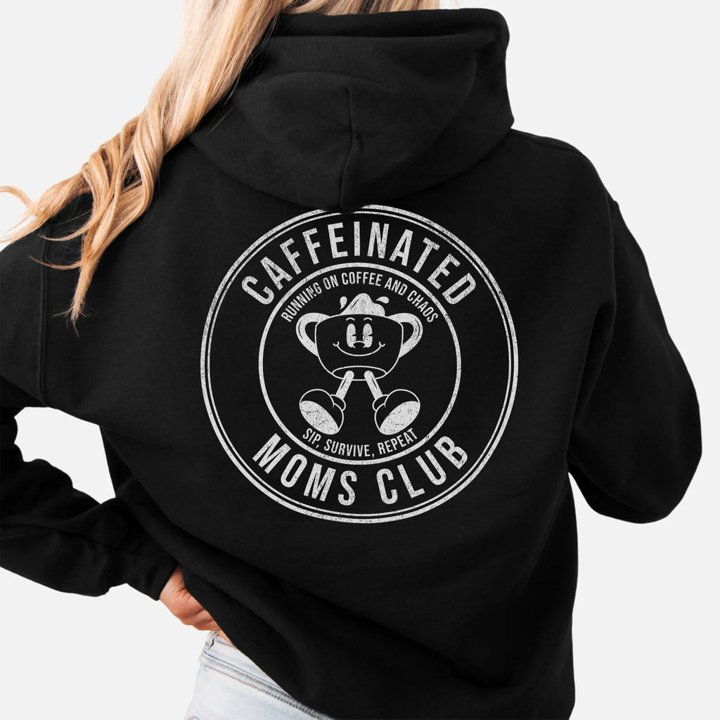 Black Oakley June Hoodie back view Caffeinated Moms Club large circle badge coffee cup mascot text Running on Coffee and Chaos Sip Survive Repeat distressed print