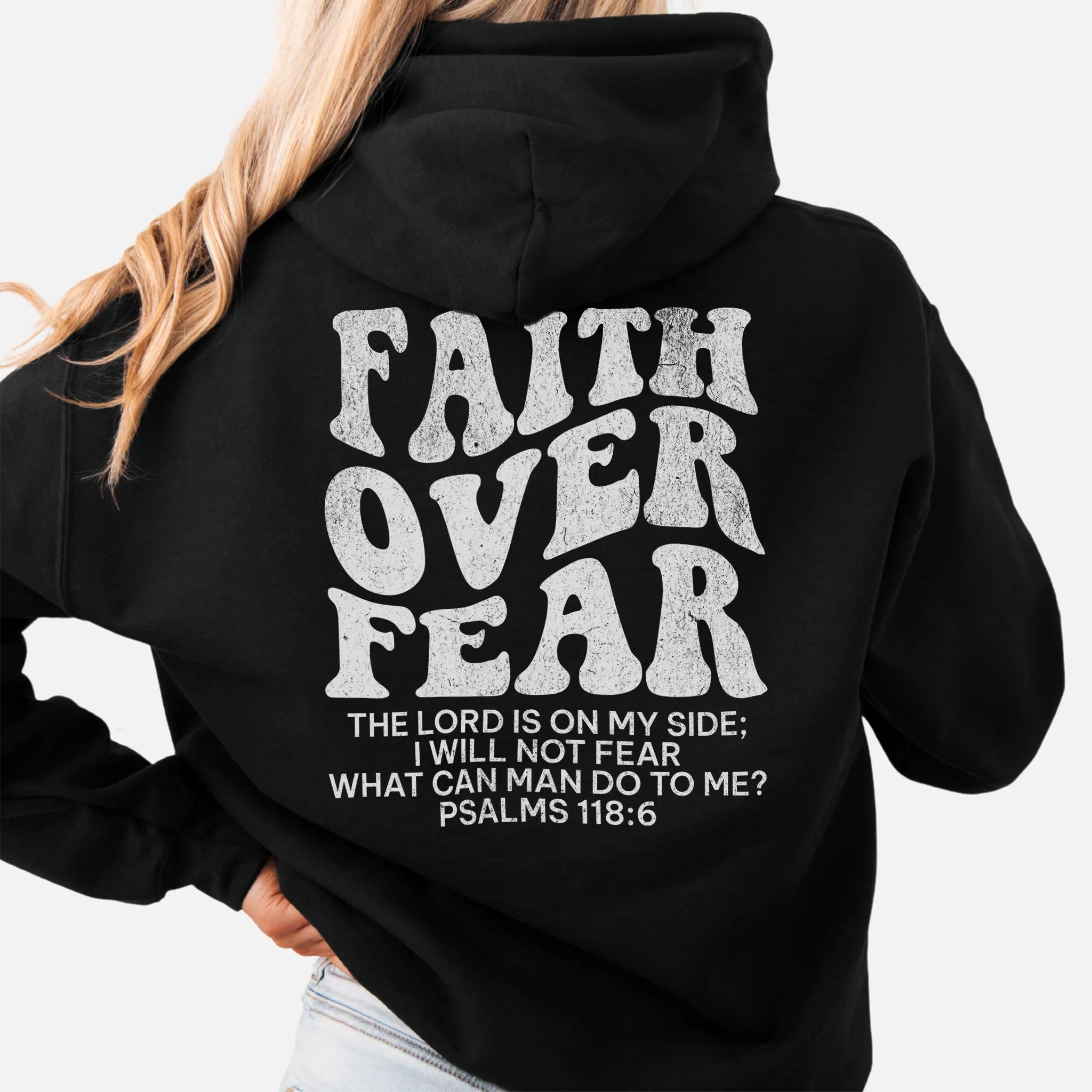 Black Oakley June hoodie, left chest badge reads Faith Over Fear with small cross, kangaroo pocket and relaxed modern fit, studio front view