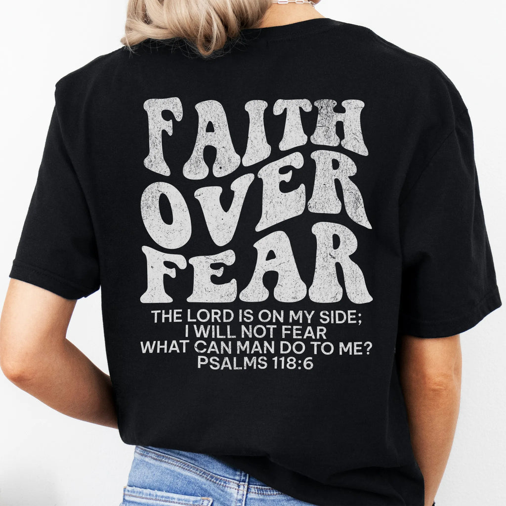 Black Oakley June t shirt, large back lettering reads Faith Over Fear with supporting scripture reference Psalms one eighteen six, studio back view