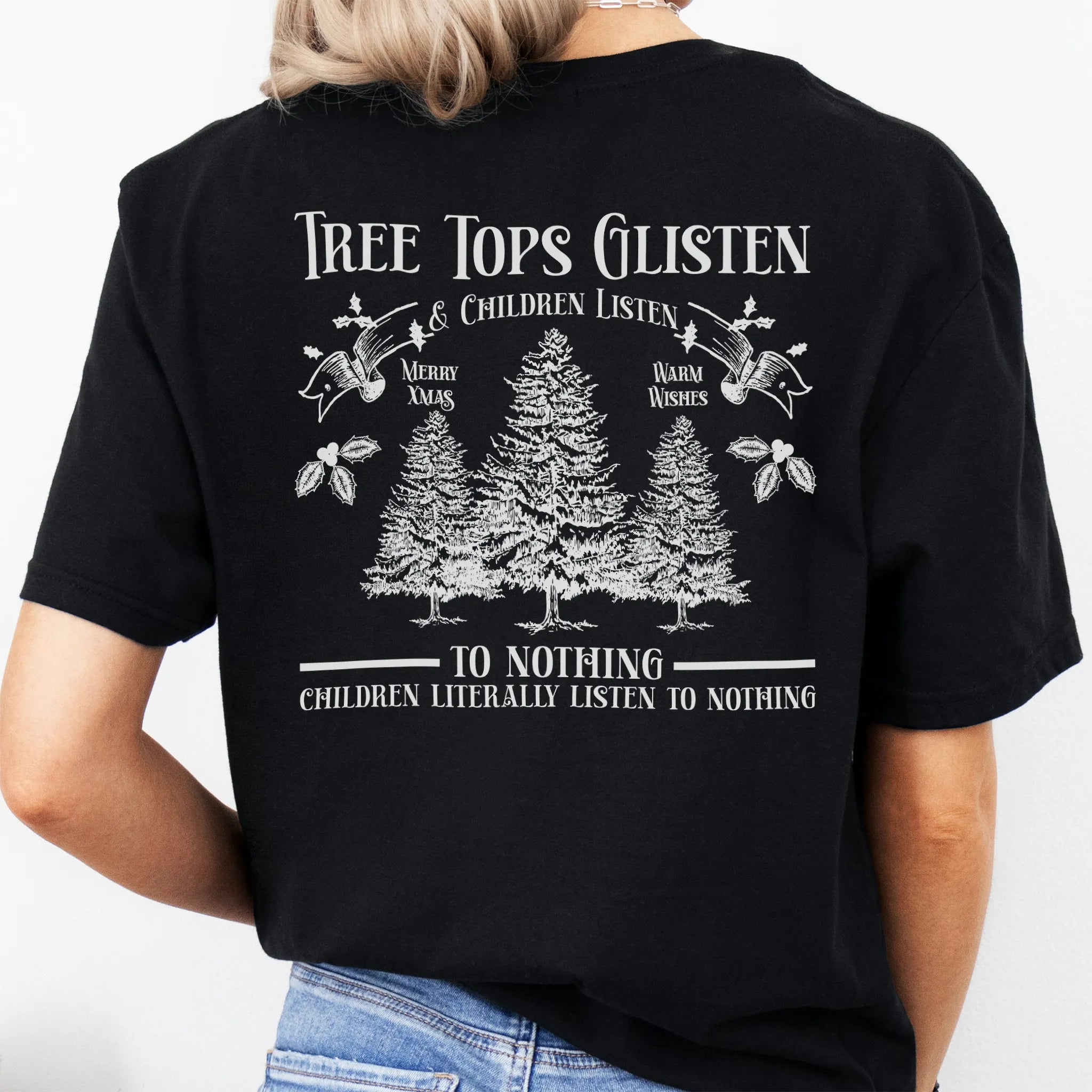 Black Oakley June tee large back print Tree Tops Glisten and Children Listen to Nothing with three evergreen trees, doves, and holly