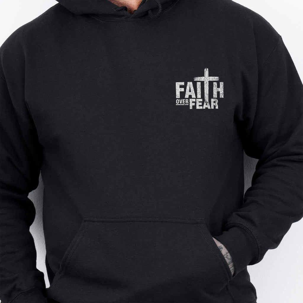 Black Oakley June hoodie, mens fit, left chest badge reads Faith Over Fear with cross, kangaroo pocket, studio front view