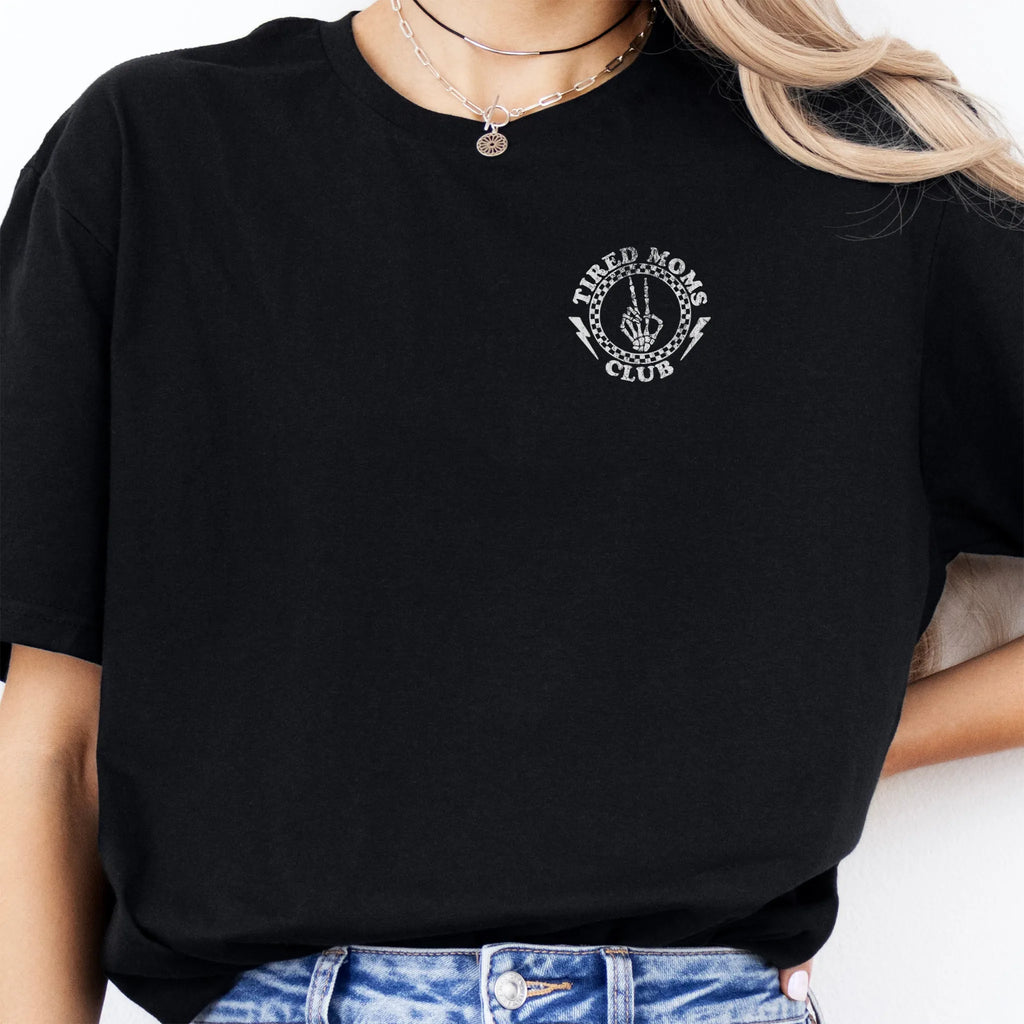 Black Oakley June T Shirt front view small left chest Tired Moms Club badge crest minimalist distressed print