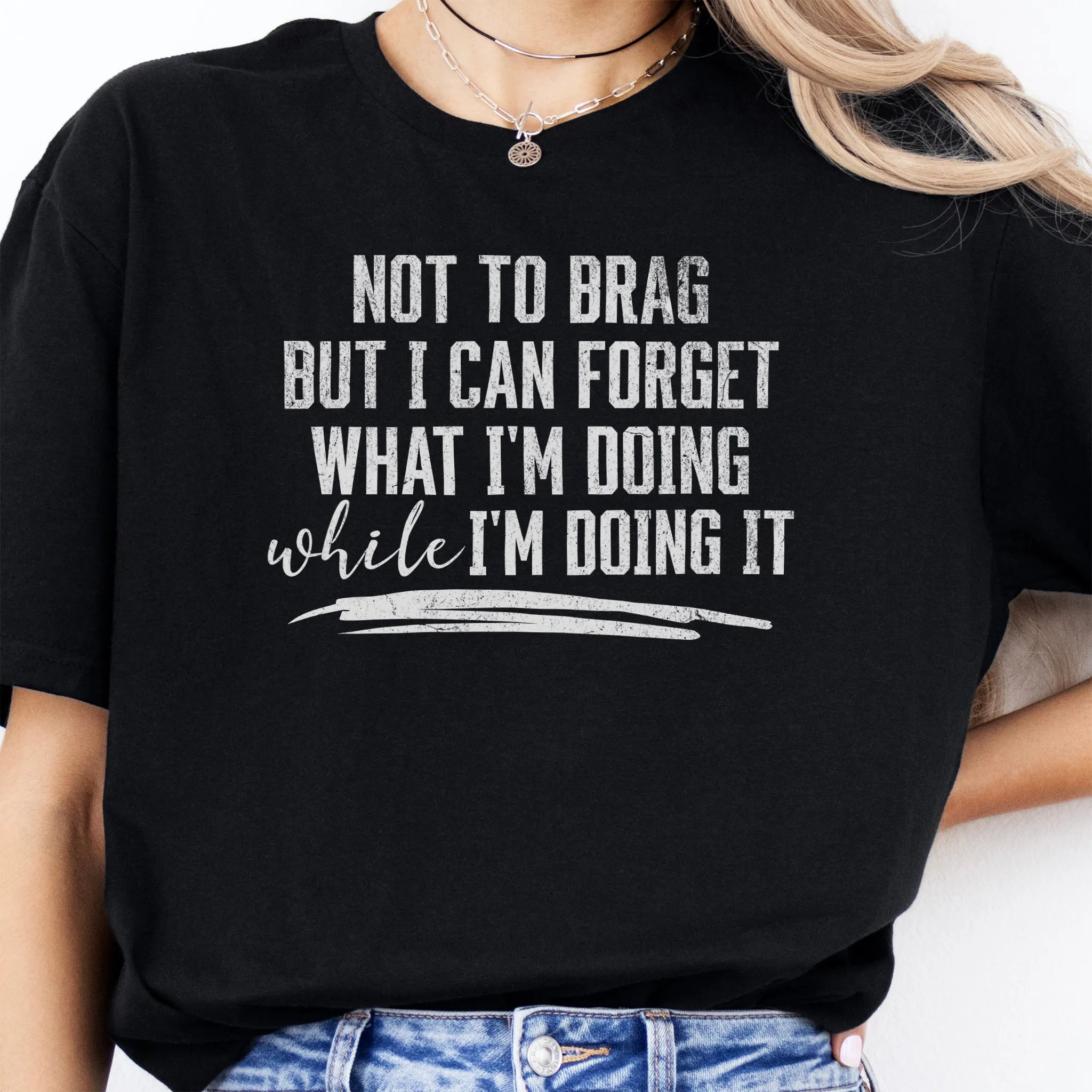 Black Oakley June T Shirt front view large text Not To Brag But I Can Forget What I’m Doing While I’m Doing It underline distressed print