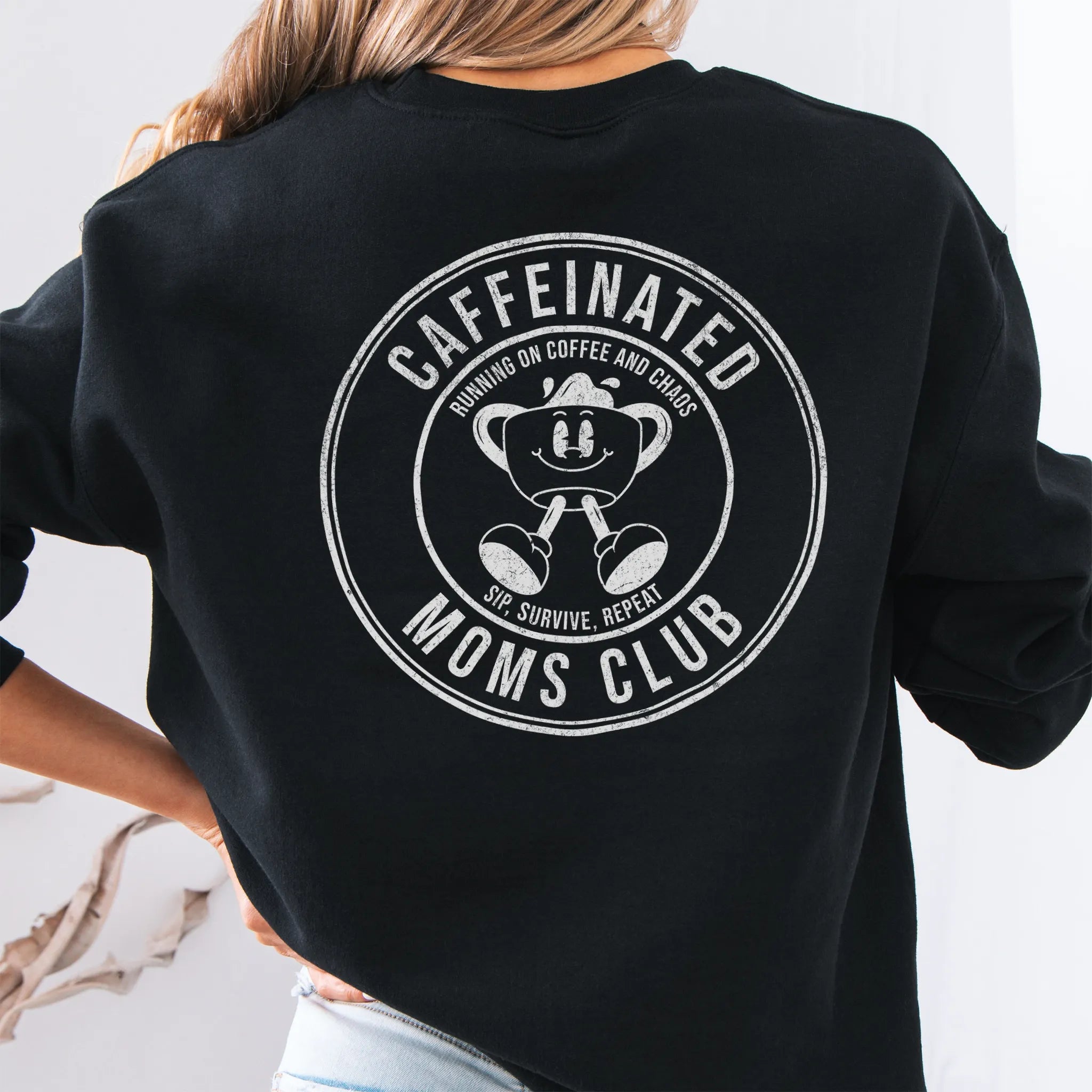 Black Oakley June Sweatshirt front view small left chest coffee cup mascot Caffeinated Moms Club minimal distressed