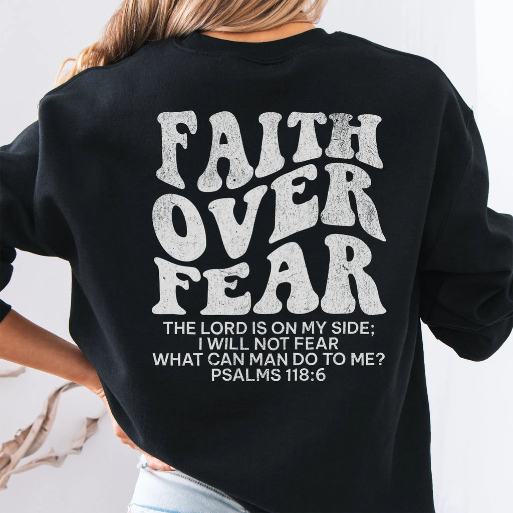 Black Oakley June sweatshirt, large back lettering reads Faith Over Fear with supporting scripture lines, studio back view
