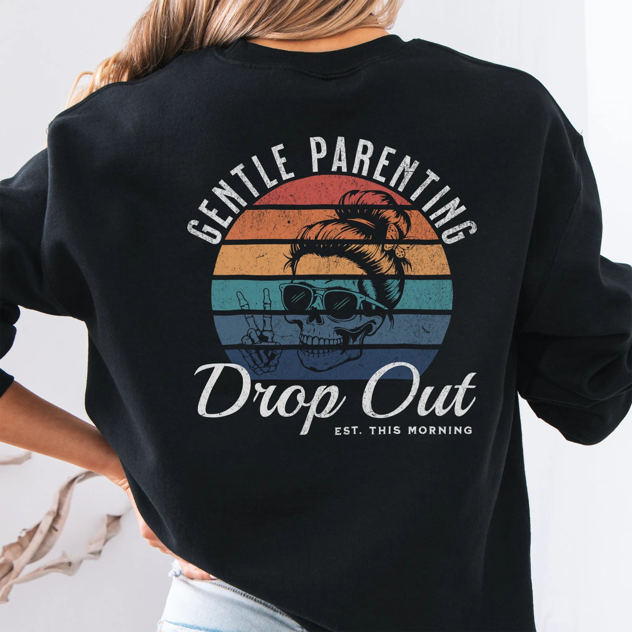 Black Oakley June Sweatshirt back view Gentle Parenting Drop Out large round retro stripe badge skull with messy bun peace sign script Est This Morning distressed print