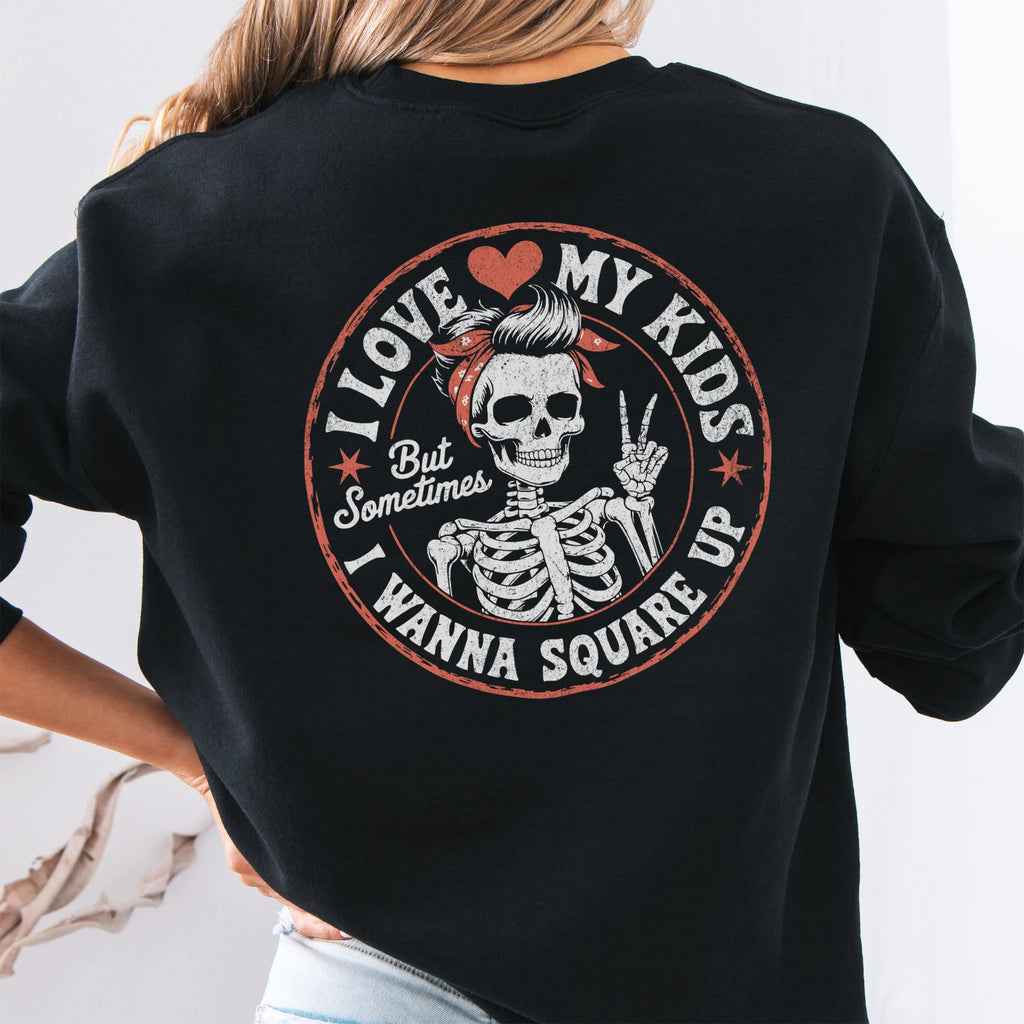 Black sweatshirt – large back circle graphic with skeleton mom giving a peace sign, headline reads “I Love My Kids But Sometimes I Wanna Square Up”, studio back view