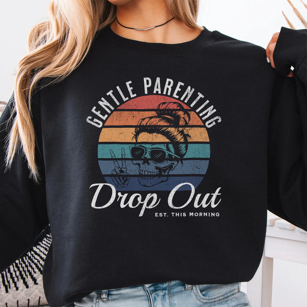 Black Oakley June Sweatshirt front view Gentle Parenting Drop Out large chest graphic skull with messy bun peace sign round retro stripe badge text Est This Morning distressed print