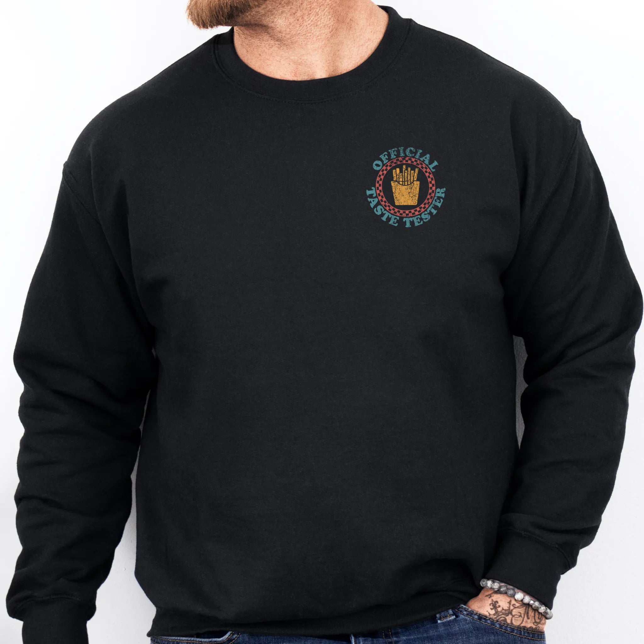 Black Oakley June Sweatshirt front view Dad Tax Official Taste Tester left chest badge retro circle fries emblem on a sweatshirt