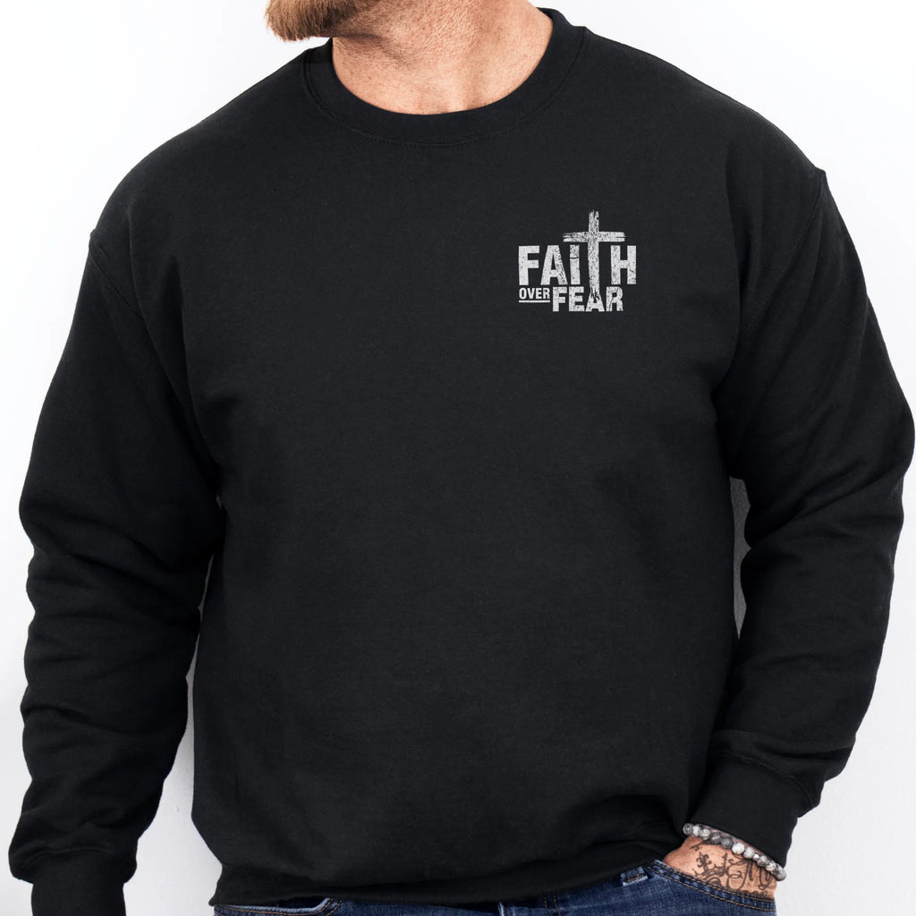 Black Oakley June sweatshirt, mens fit, left chest badge reads Faith Over Fear with cross, studio front view
