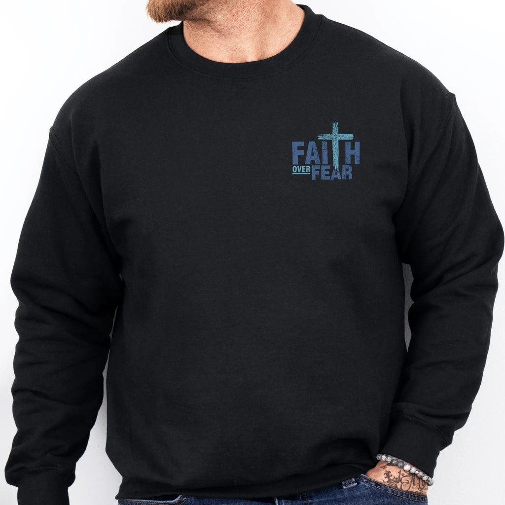 Black Oakley June sweatshirt, mens fit, left chest badge reads Faith Over Fear with small cross, studio front view