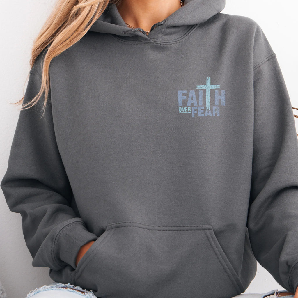 Charcoal Oakley June hoodie, left chest badge reads Faith Over Fear with small cross, kangaroo pocket and relaxed modern fit, studio front view