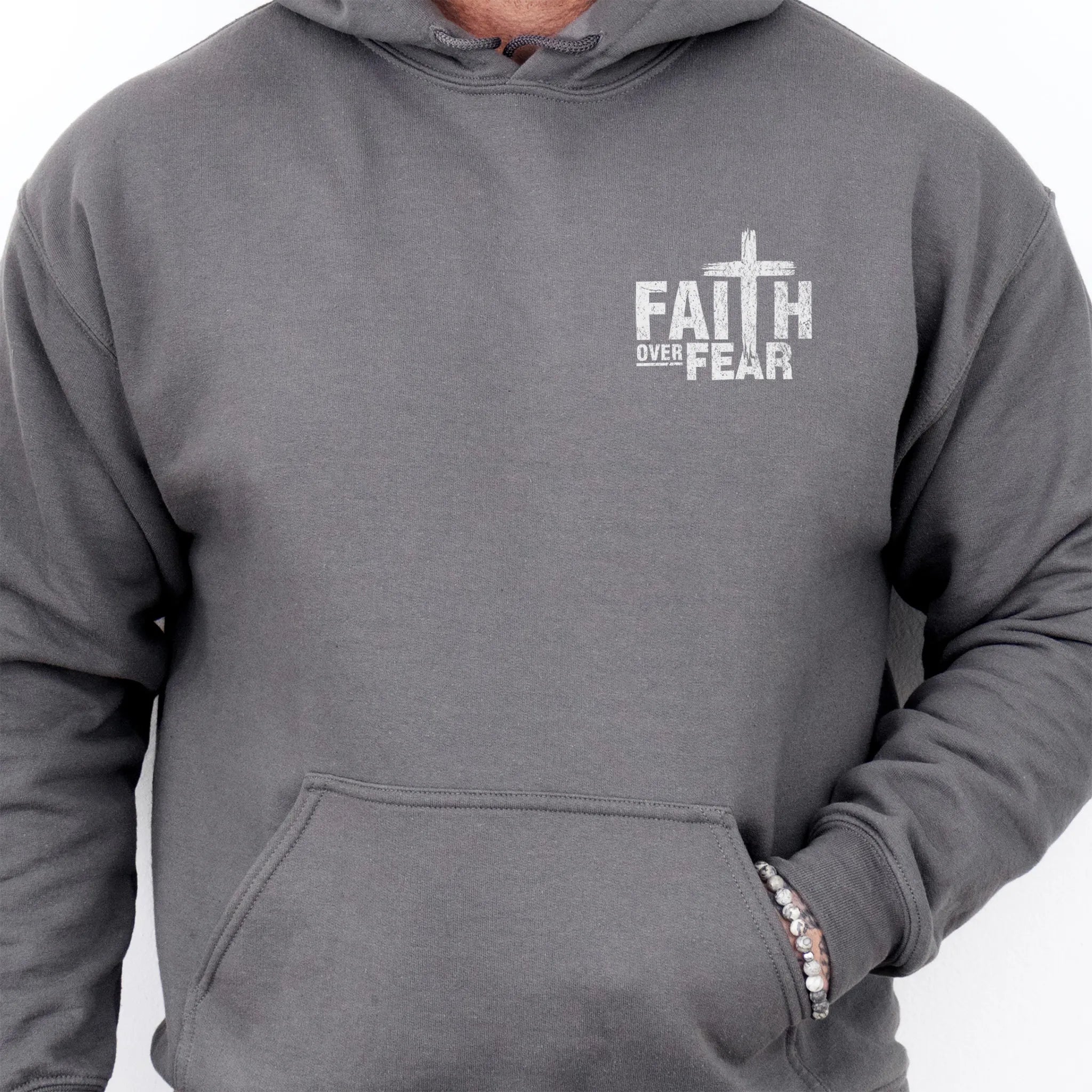 Charcoal Oakley June hoodie, mens fit, left chest badge reads Faith Over Fear with cross, kangaroo pocket, studio front view