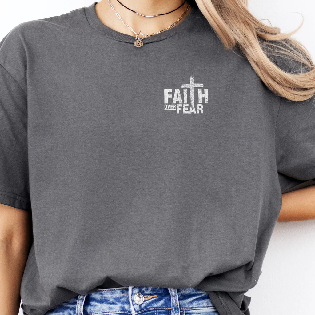 Charcoal Oakley June t shirt, left chest badge reads Faith Over Fear with small cross, relaxed modern fit, studio front view