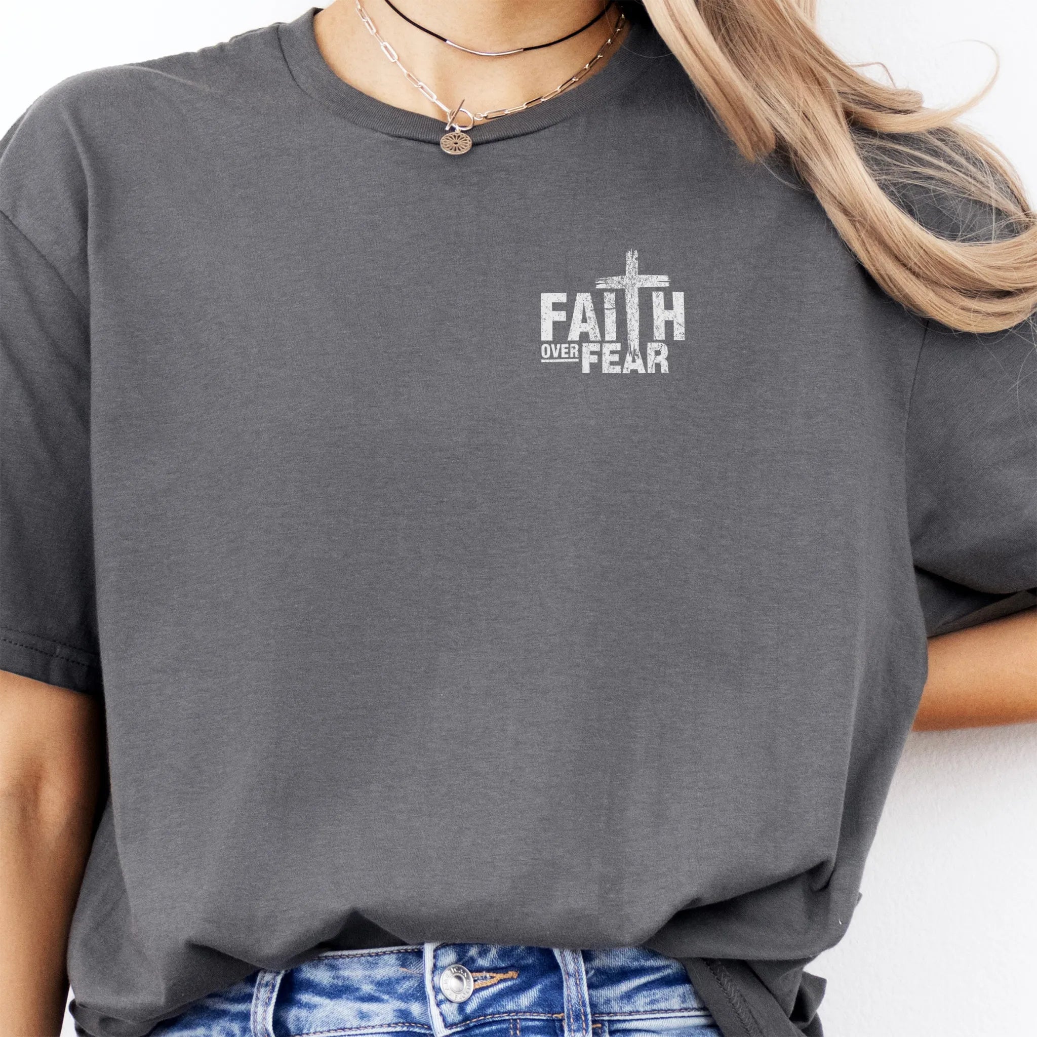 Charcoal Oakley June t shirt, left chest badge reads Faith Over Fear with small cross, relaxed modern fit, studio front view