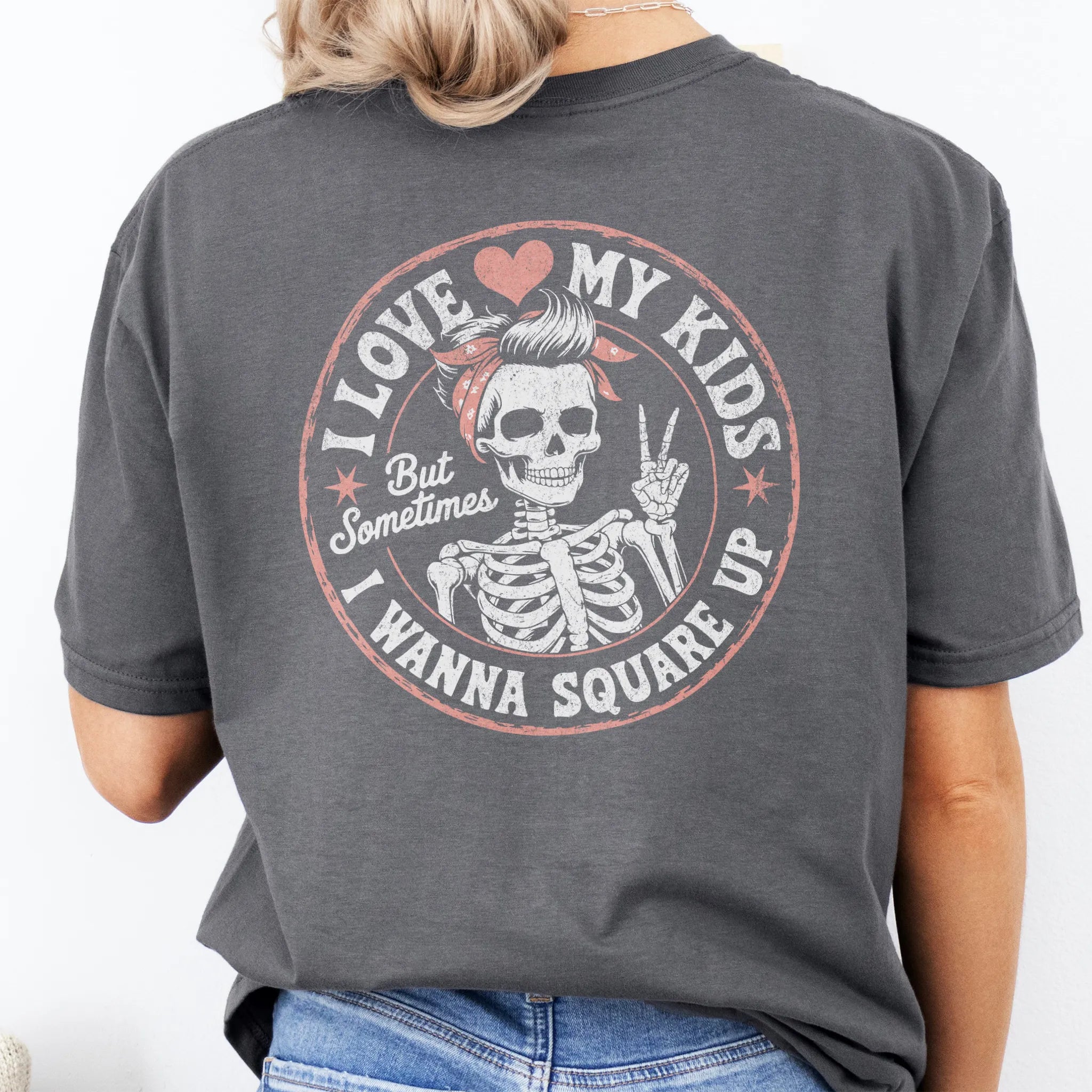 Charcoal t-shirt – large back graphic with skeleton mom in bandana and peace sign inside a round badge, headline reads “I Love My Kids But Sometimes I Wanna Square Up”, studio back view