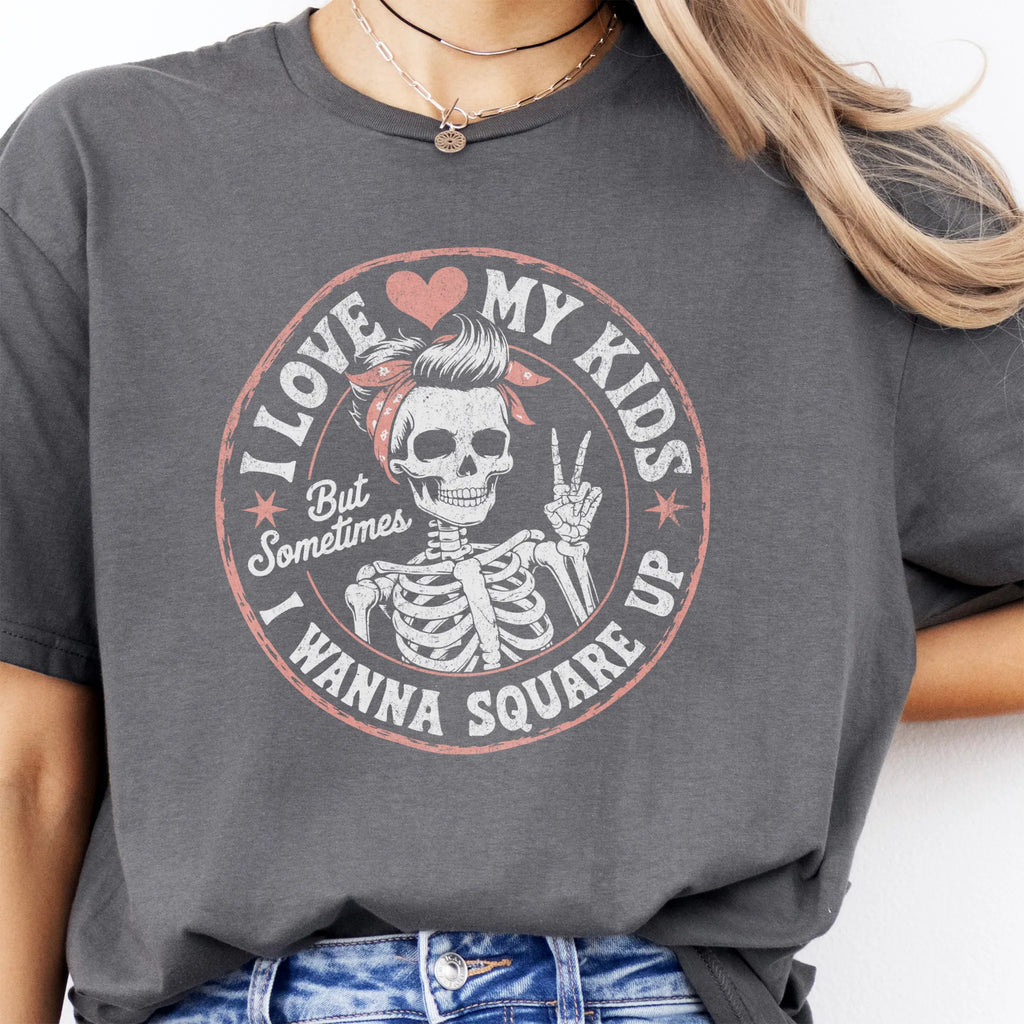 Charcoal t-shirt – large front circle graphic with skeleton mom in bandana and peace sign, headline reads “I Love My Kids But Sometimes I Wanna Square Up”, studio front view
