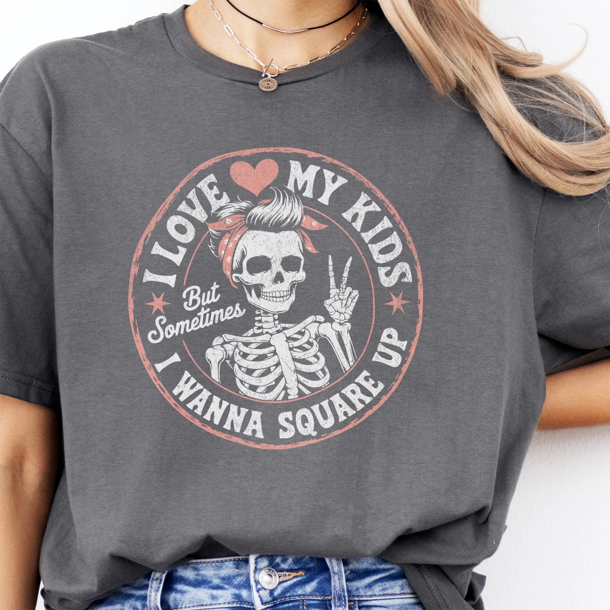 Charcoal t-shirt – large front circle graphic with skeleton mom in bandana and peace sign, headline reads “I Love My Kids But Sometimes I Wanna Square Up”, studio front view