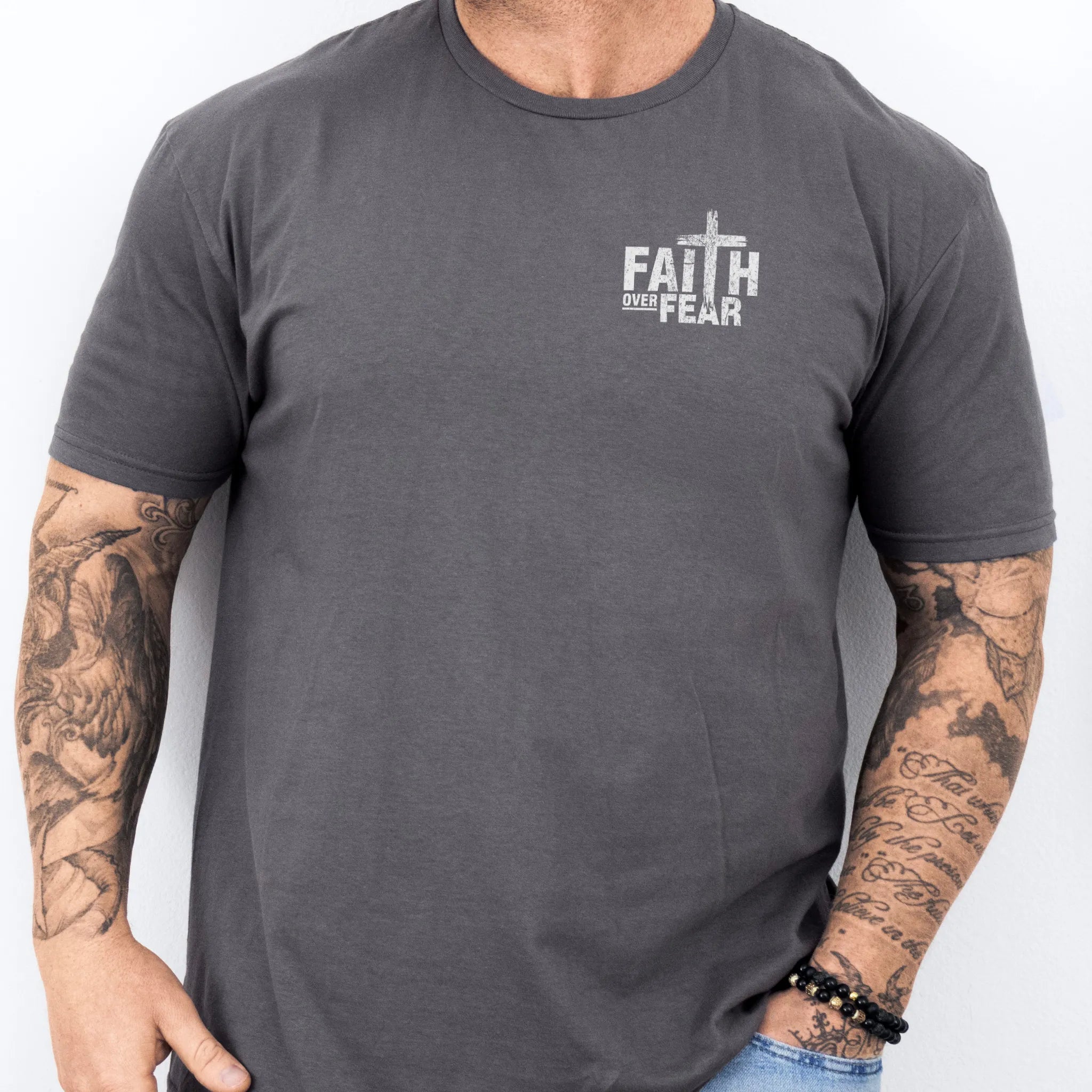 Charcoal Oakley June t shirt, mens fit, left chest badge reads Faith Over Fear with cross, studio front view