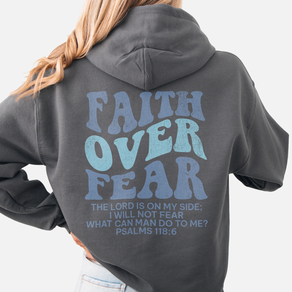 Charcoal Oakley June hoodie, large back lettering reads Faith Over Fear with supporting scripture lines, hood up, studio back view