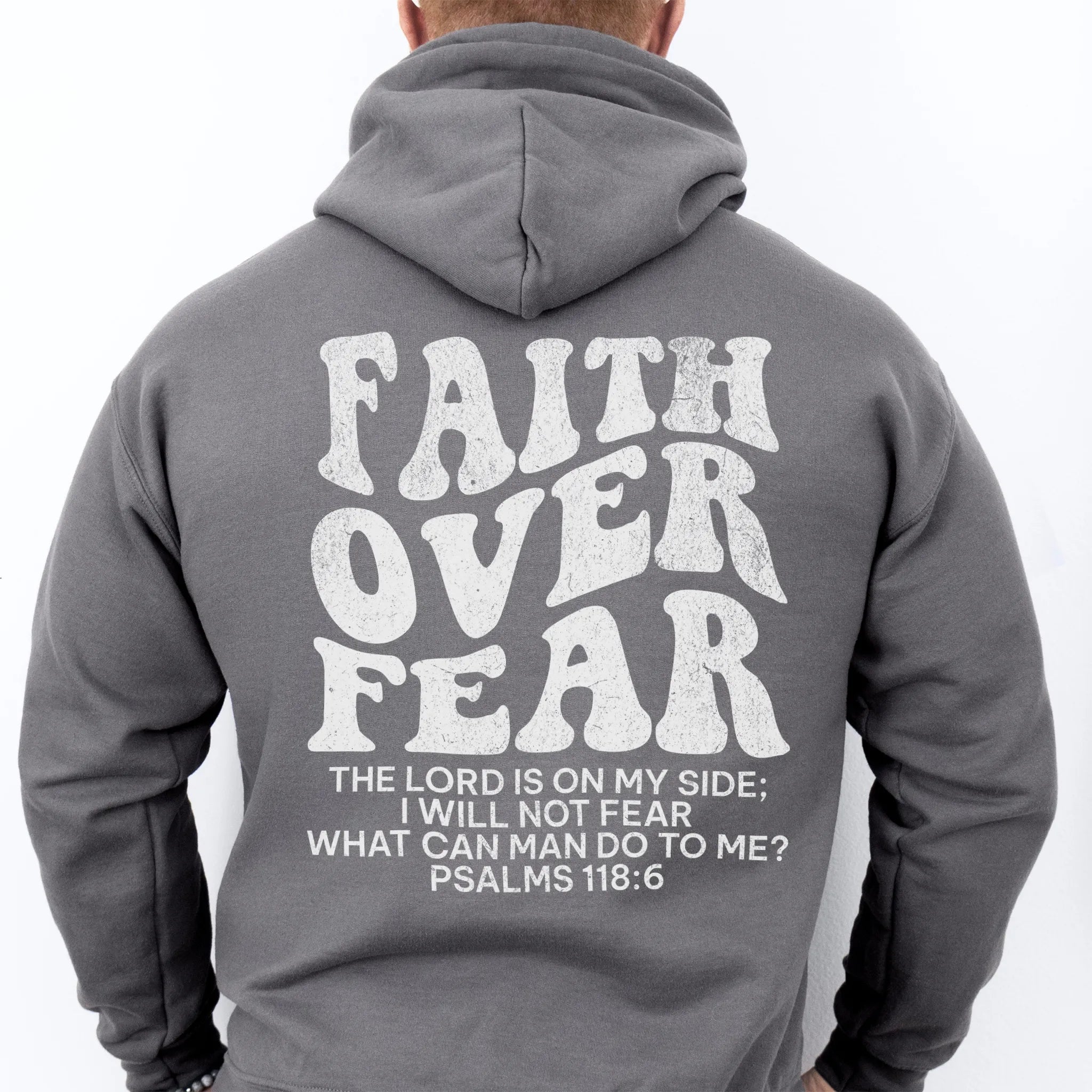 Charcoal Oakley June hoodie, mens fit, large back lettering reads Faith Over Fear with supporting scripture lines, studio back view