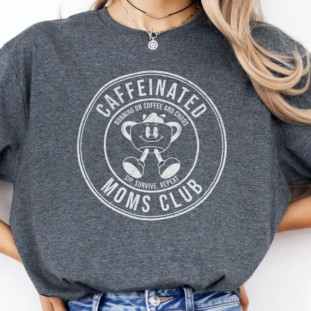 Dark Heather Oakley June T Shirt front view large Caffeinated Moms Club circle badge coffee cup mascot text Running on Coffee and Chaos Sip Survive Repeat distressed