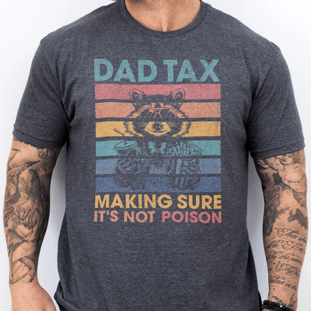 Dark Heather Oakley June T Shirt front view Dad Tax retro stripes raccoon wearing sunglasses holding soda and fries text Making Sure It’s Not Poison distressed print