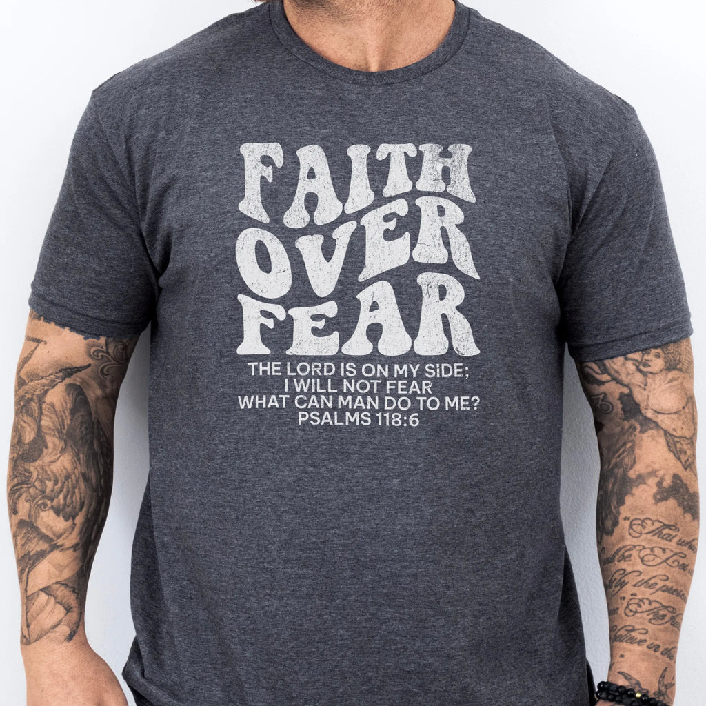 Dark Heather Oakley June t shirt, mens fit, large front lettering reads Faith Over Fear with supporting scripture lines, studio front view