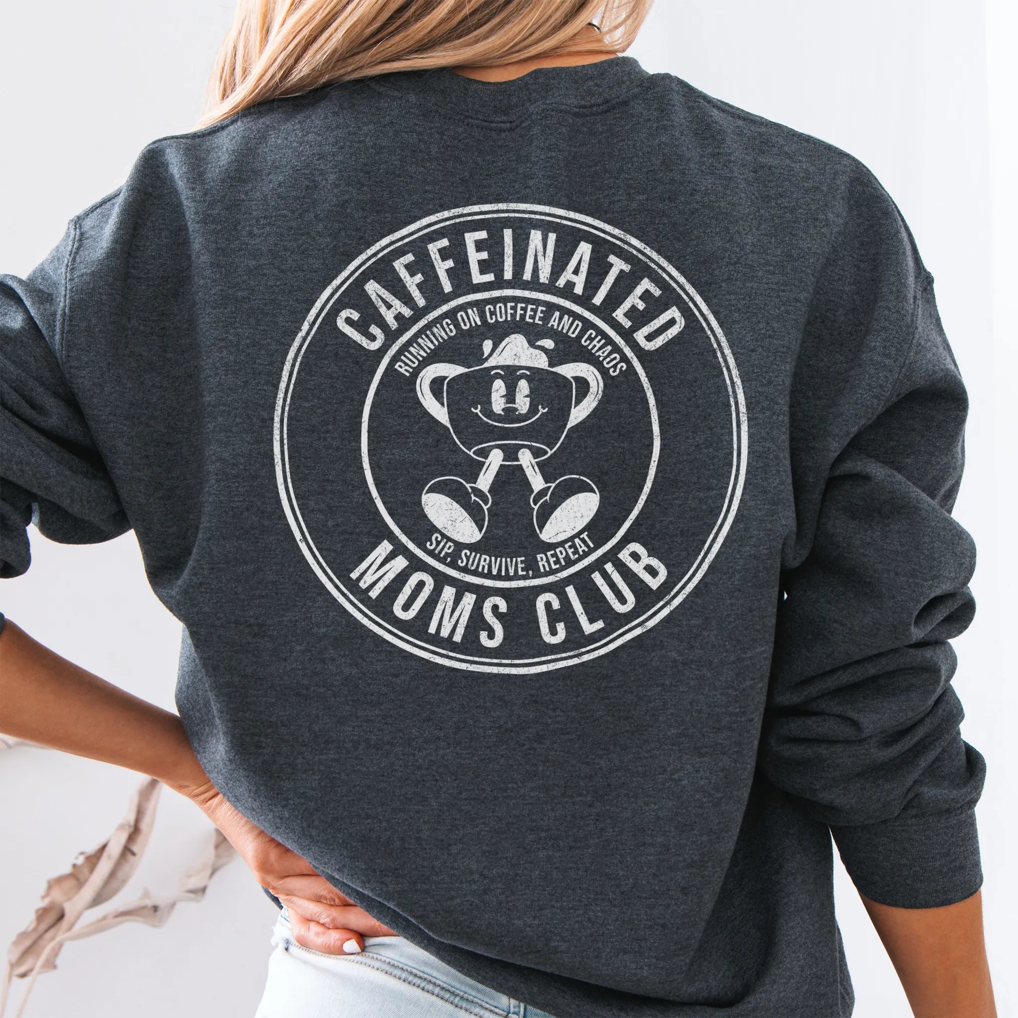 Dark Heather Oakley June Sweatshirt front view small left chest coffee cup mascot Caffeinated Moms Club minimal distressed