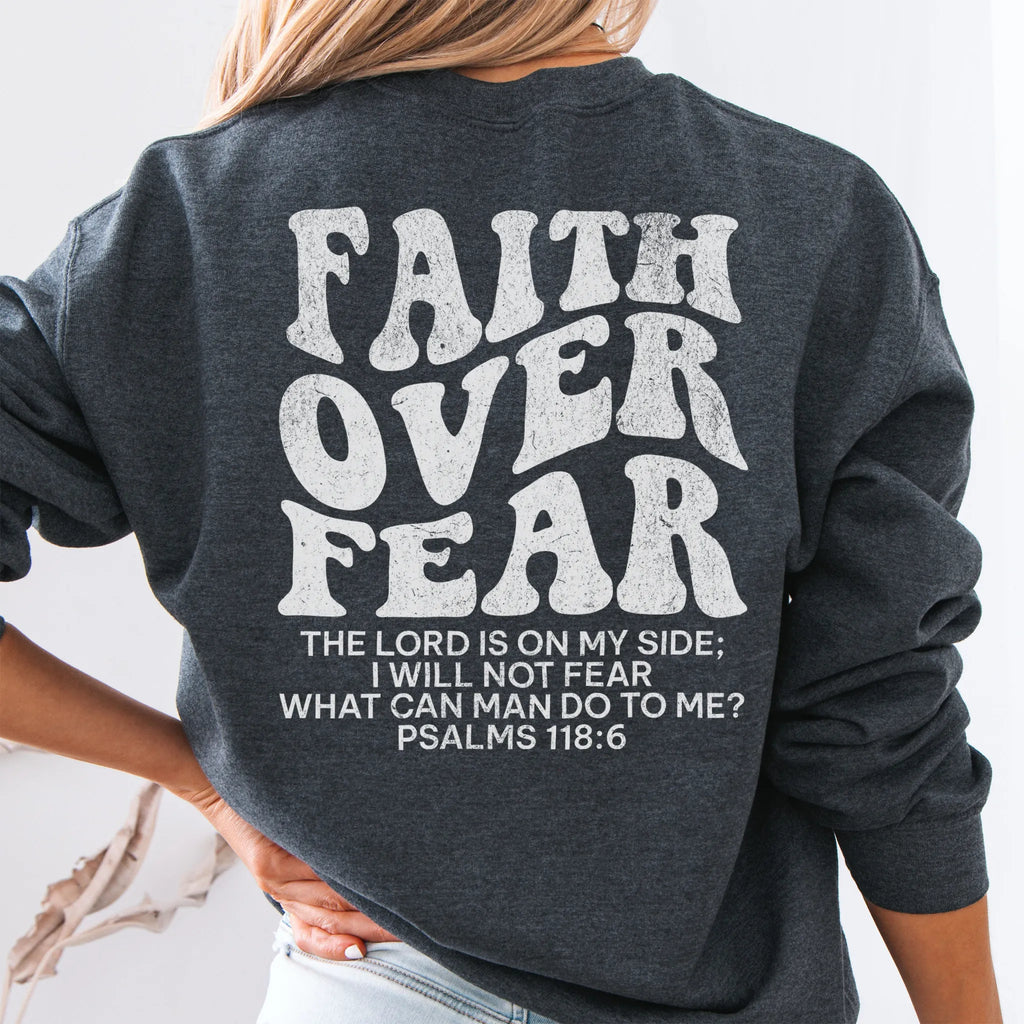 Dark Heather Oakley June sweatshirt, large back lettering reads Faith Over Fear with supporting scripture lines, studio back view