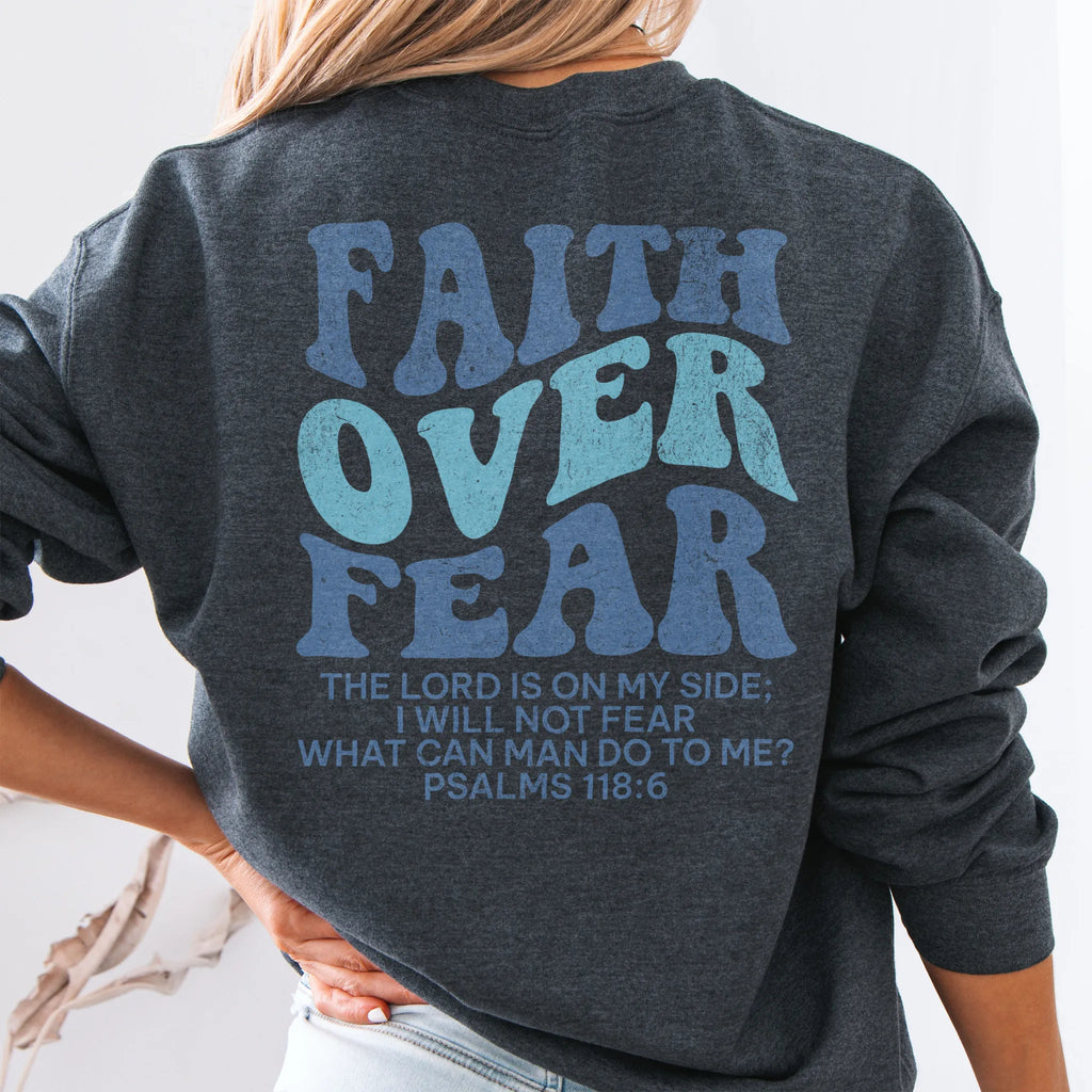 Dark Heather Oakley June sweatshirt, large back lettering reads Faith Over Fear with supporting scripture lines, studio back view