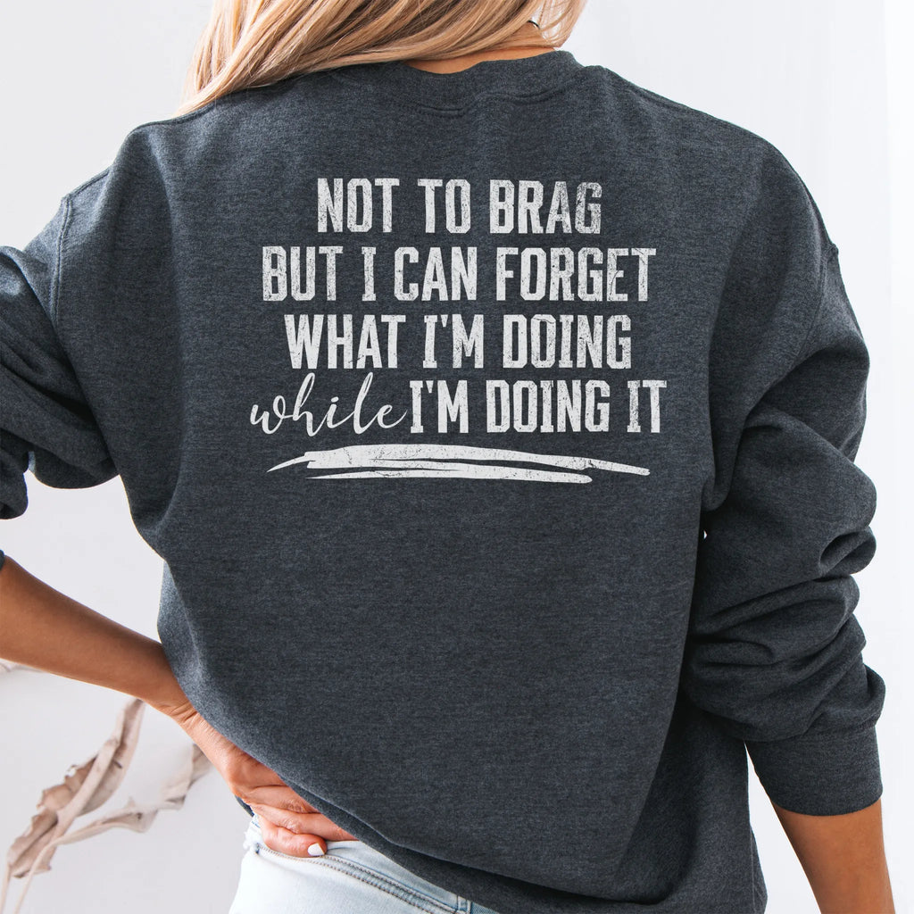 Dark Heather Oakley June Sweatshirt back view large text Not To Brag But I Can Forget What I’m Doing While I’m Doing It underline distressed print