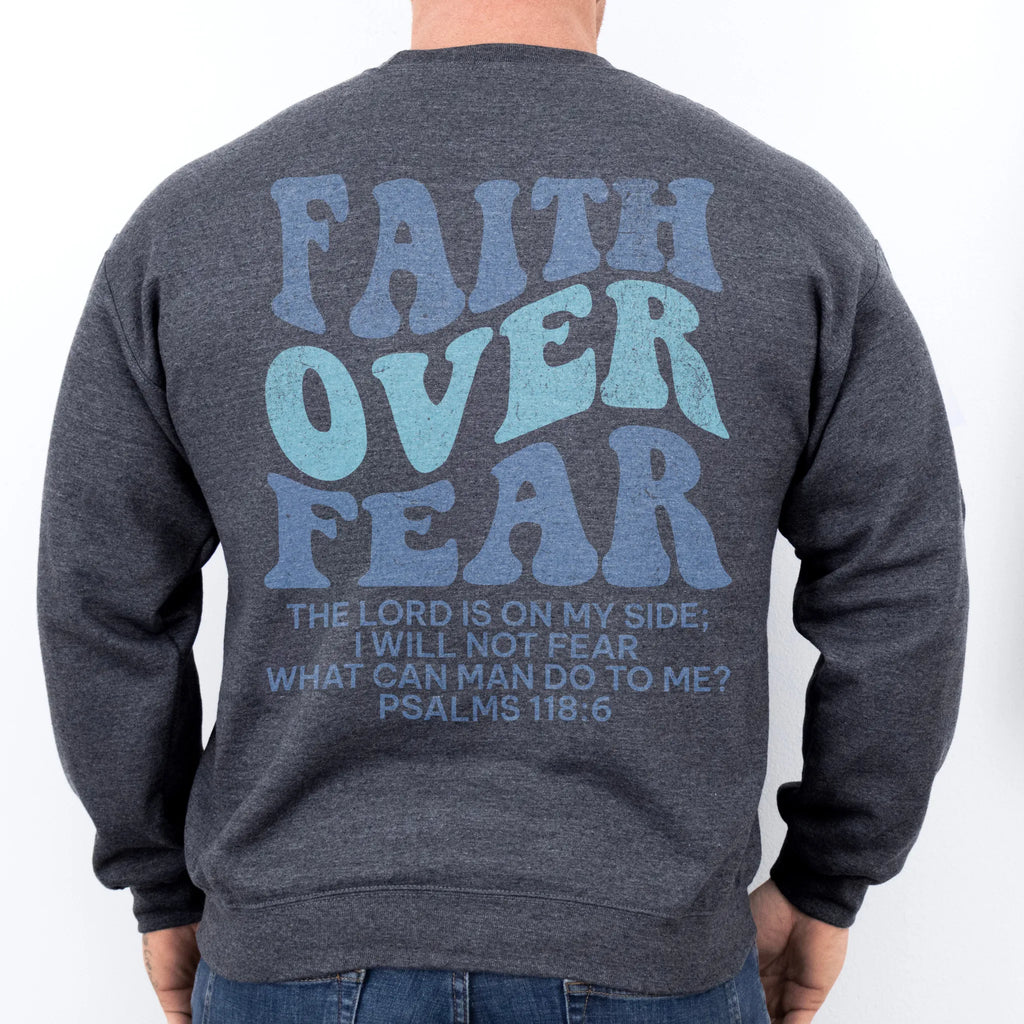 Dark Heather Oakley June sweatshirt, mens fit, large back lettering reads Faith Over Fear with supporting scripture lines, studio back view