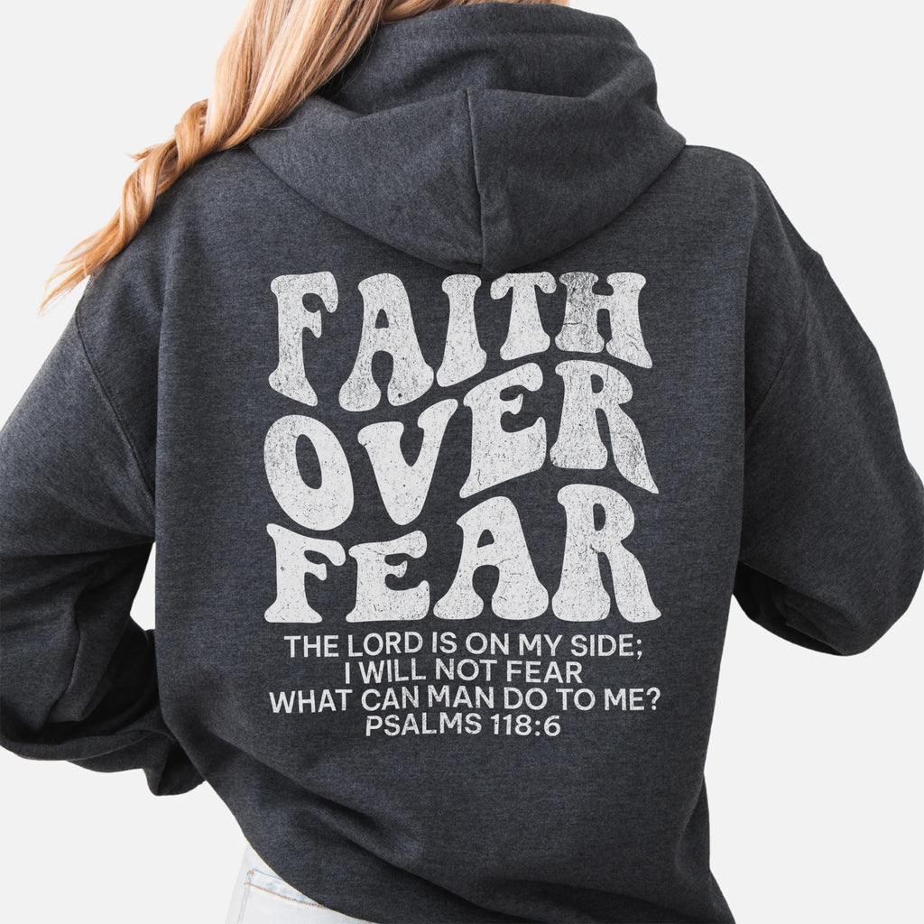 Dark Heather Oakley June hoodie, large back lettering reads Faith Over Fear with supporting scripture lines, hood up, studio back view