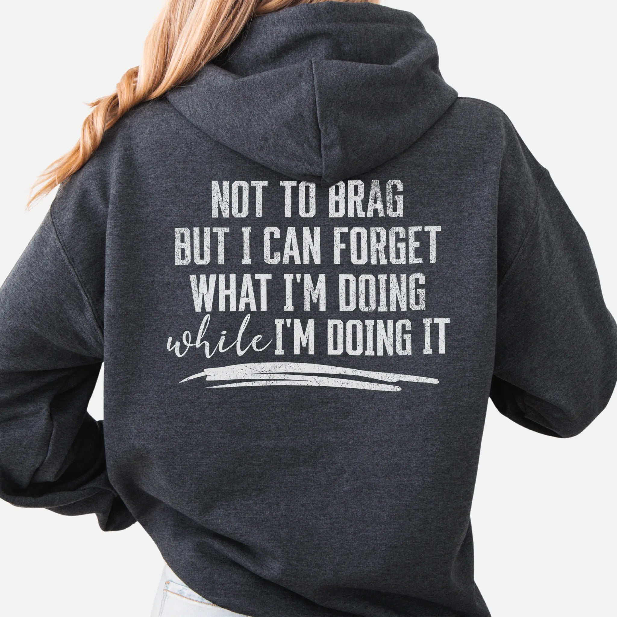 Dark Heather Oakley June Hoodie back view large text Not To Brag But I Can Forget What I’m Doing While I’m Doing It underline distressed print
