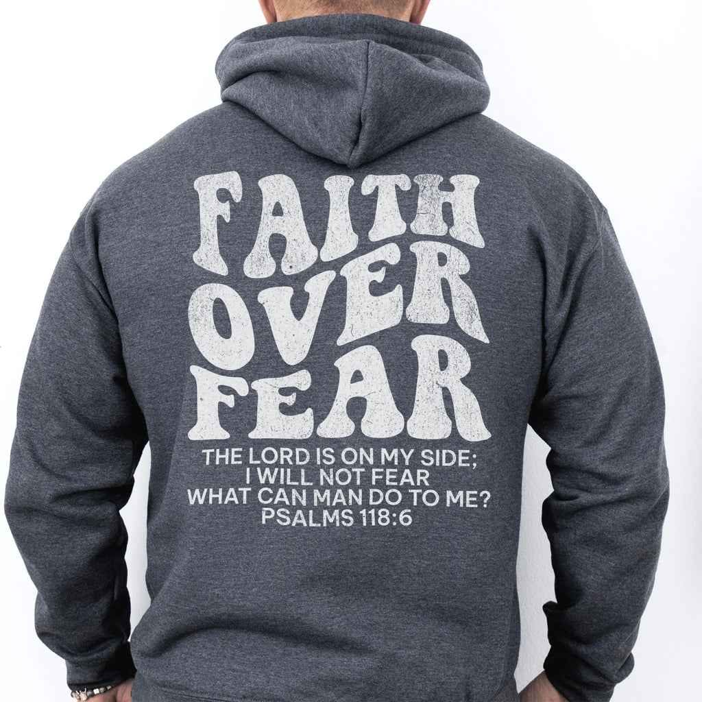 Dark Heather Oakley June hoodie, mens fit, large back lettering reads Faith Over Fear with supporting scripture lines, studio back view