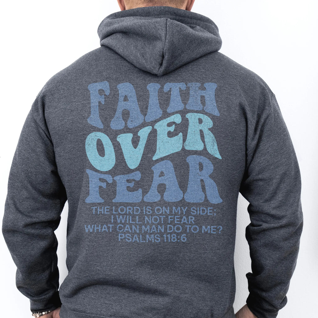 Dark Heather Oakley June hoodie, mens fit, large back lettering reads Faith Over Fear with supporting scripture lines, hood up, studio back view