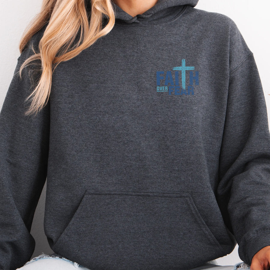Dark Heather Oakley June hoodie, left chest badge reads Faith Over Fear with small cross, kangaroo pocket and relaxed modern fit, studio front view