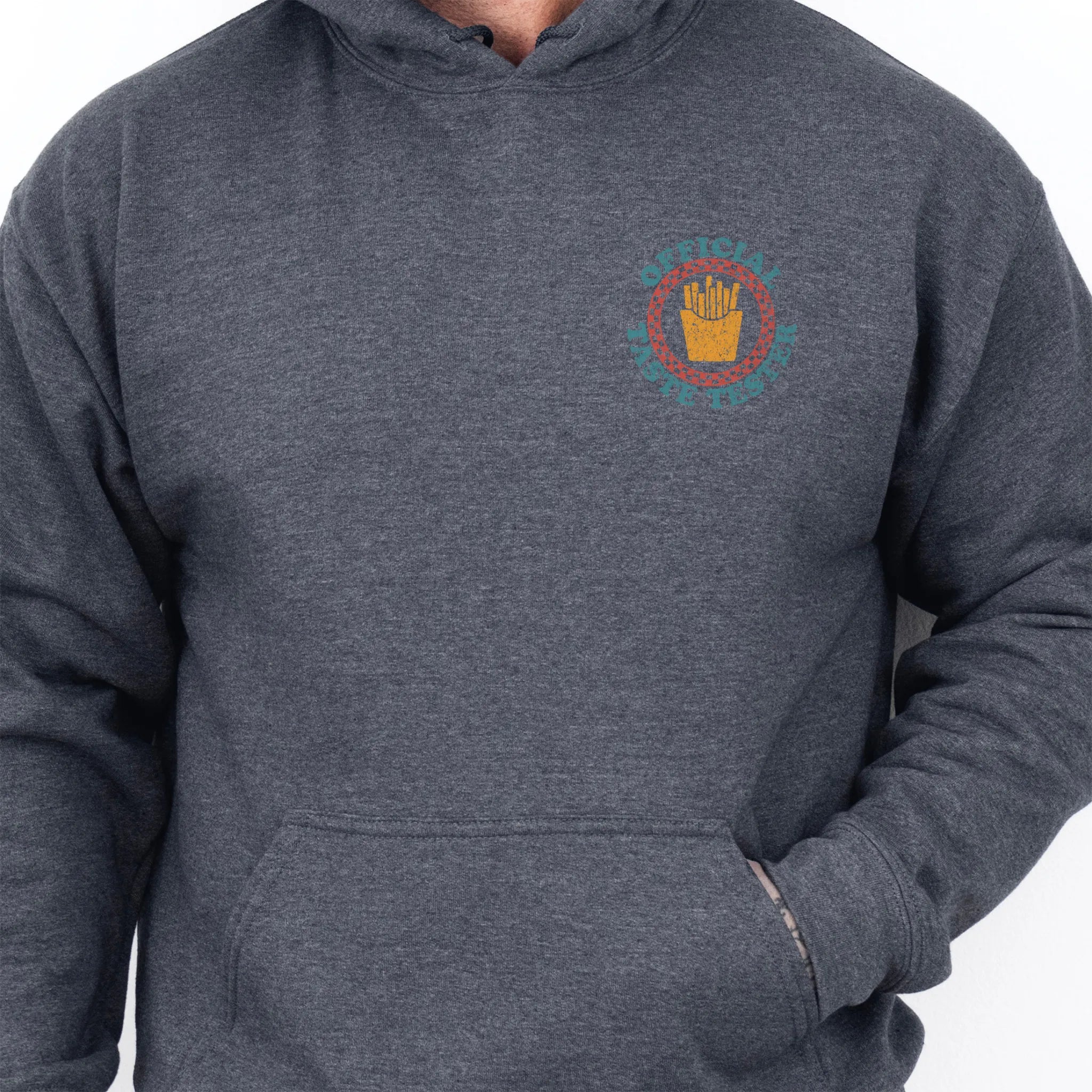 Dark Heather Oakley June Hoodie front view Dad Tax Official Taste Tester left chest badge retro circle fries emblem kangaroo pocket drawstrings visible