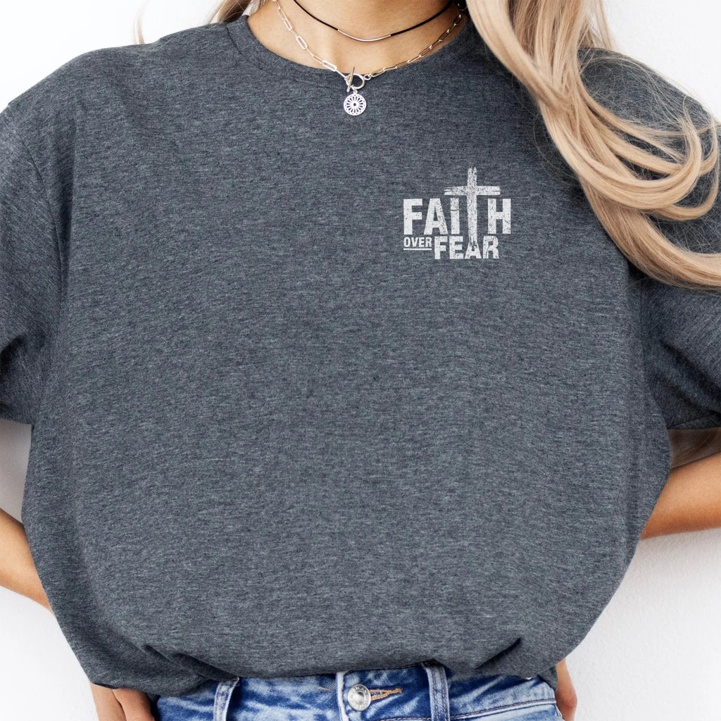 Dark Heather Oakley June t shirt, left chest badge reads Faith Over Fear with small cross, relaxed modern fit, studio front view