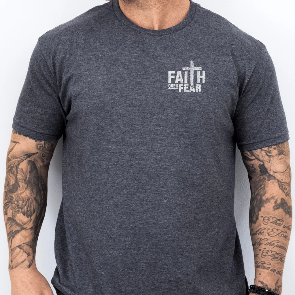 Dark Heather Oakley June t shirt, mens fit, left chest badge reads Faith Over Fear with cross, studio front view